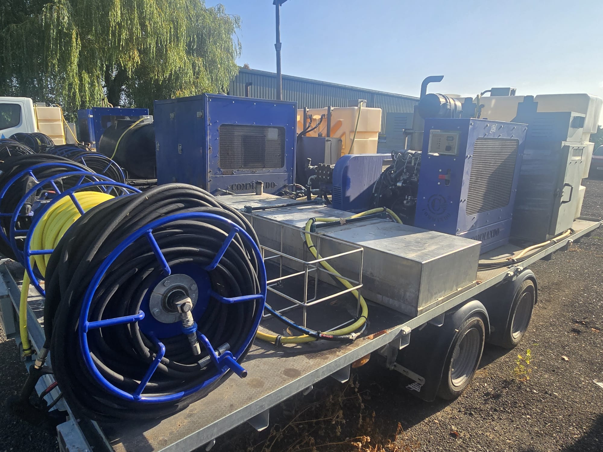 High-pressure hose reels and hot wash units on the trailer